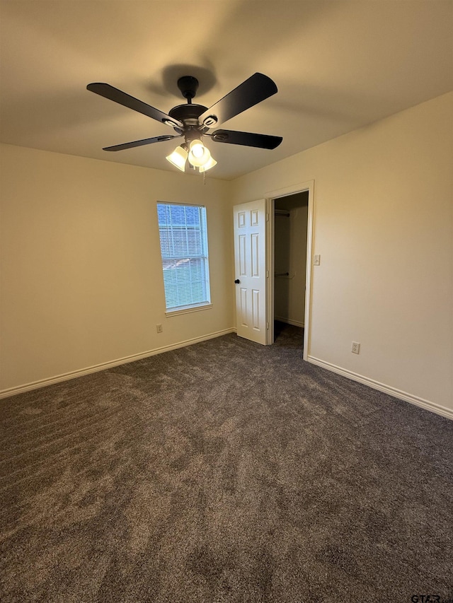203 Macarthur St, Tyler, TX 75704 - unfurnished bedroom featuring dark colored carpet, baseboards, and ceiling fan