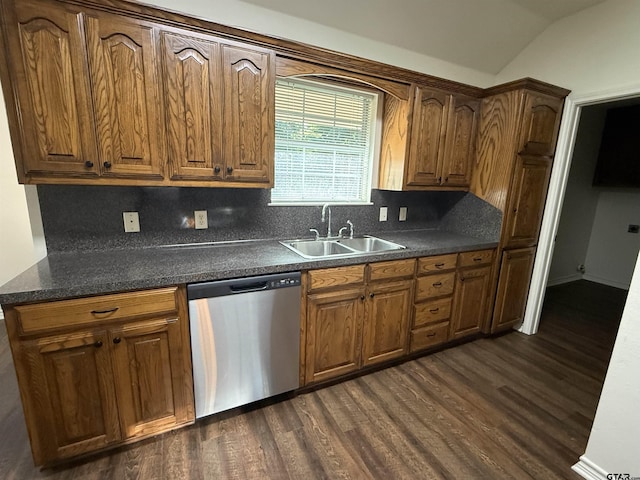 203 Macarthur St, Tyler, TX 75704 - kitchen featuring dishwasher, a sink, dark wood-type flooring, dark countertops, and lofted ceiling