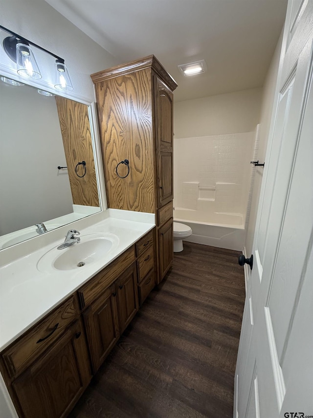 203 Macarthur St, Tyler, TX 75704 - bathroom with wood finished floors, toilet, vanity, and shower / bathtub combination
