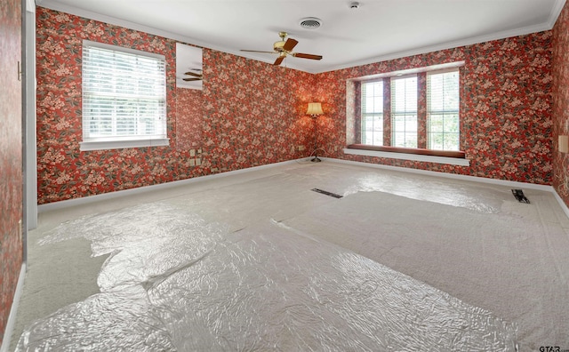 1101 Canada St, Jacksonville, TX 75766 - unfurnished room with crown molding, wallpapered walls, a ceiling fan, baseboards, and carpet floors