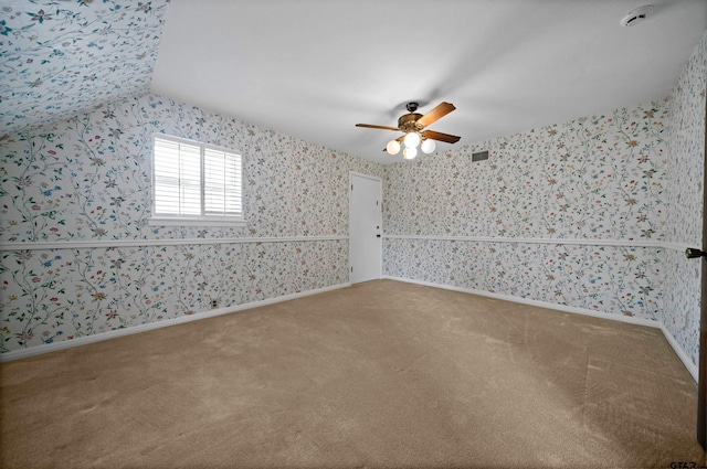 1101 Canada St, Jacksonville, TX 75766 - carpeted empty room with wallpapered walls, ceiling fan, and a smoke detector