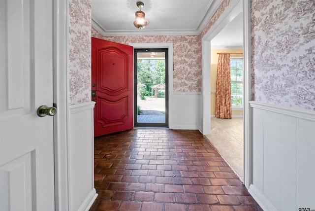 1101 Canada St, Jacksonville, TX 75766 - entrance foyer featuring wainscoting, wallpapered walls, brick flooring, and plenty of natural light