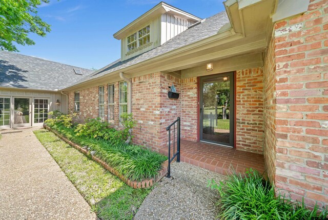 1101 Canada St, Jacksonville, TX 75766 - entrance to property with brick siding, board and batten siding, and a shingled roof