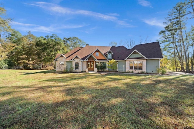 craftsman-style home featuring a front lawn