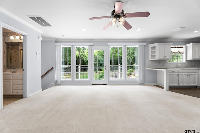 801 Wilder Way, Tyler, TX 75703 - unfurnished living room featuring ornamental molding, dark carpet, a ceiling fan, and recessed lighting