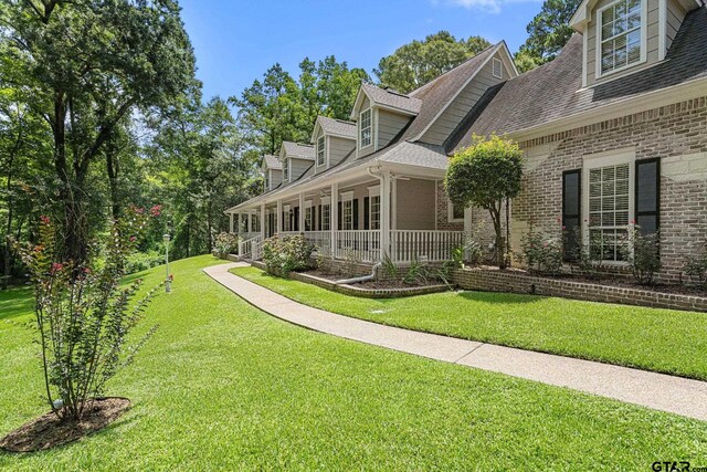 801 Wilder Way, Tyler, TX 75703 - view of green lawn with a porch