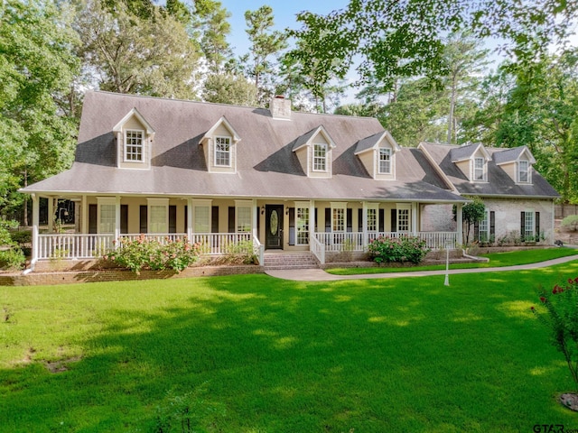 801 Wilder Way, Tyler, TX 75703 - view of front of house with a chimney, covered porch, and a front lawn