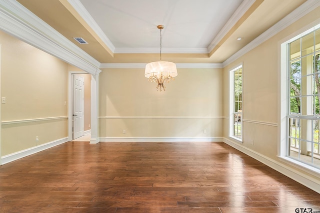 801 Wilder Way, Tyler, TX 75703 - empty room featuring a raised ceiling, a chandelier, dark wood-style floors, and crown molding