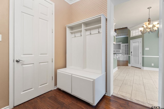 801 Wilder Way, Tyler, TX 75703 - mudroom featuring a chandelier, dark wood-style floors, and ornamental molding