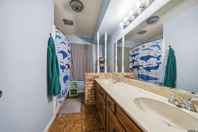 10236 County Road 2253, Tyler, TX 75707 - full bath featuring double vanity and baseboards