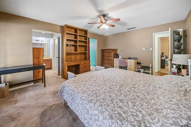 10236 County Road 2253, Tyler, TX 75707 - bedroom featuring light colored carpet, a textured ceiling, and a ceiling fan