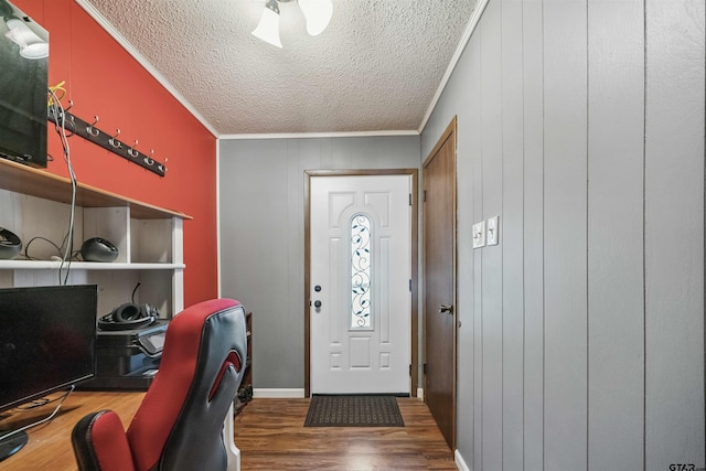 10236 County Road 2253, Tyler, TX 75707 - entryway featuring a textured ceiling, ornamental molding, wood finished floors, and a ceiling fan