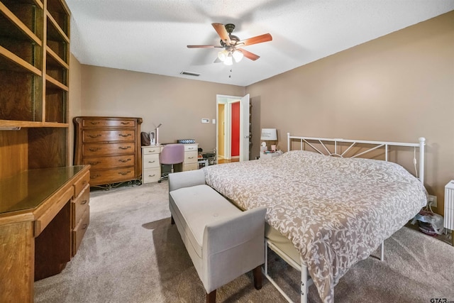 10236 County Road 2253, Tyler, TX 75707 - bedroom with carpet flooring, a desk, and a ceiling fan