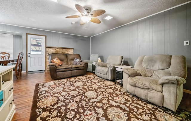 10236 County Road 2253, Tyler, TX 75707 - living room featuring wood finished floors, a ceiling fan, and a textured ceiling