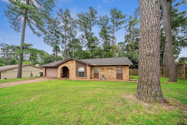 10236 County Road 2253, Tyler, TX 75707 - view of front of property featuring driveway, a garage, brick siding, and a shingled roof