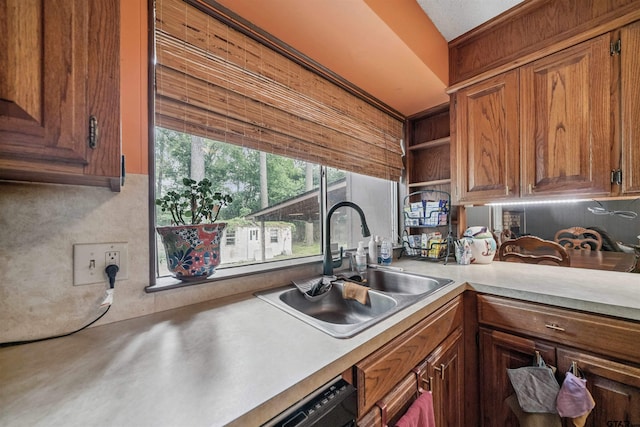 10236 County Road 2253, Tyler, TX 75707 - kitchen with light countertops, open shelves, and brown cabinets