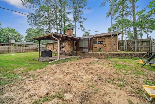 10236 County Road 2253, Tyler, TX 75707 - rear view of property with a patio, a chimney, brick siding, and a fenced backyard