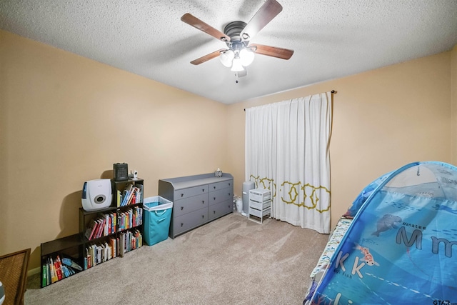 10236 County Road 2253, Tyler, TX 75707 - bedroom featuring carpet floors, ceiling fan, and a textured ceiling