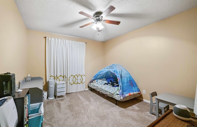 10236 County Road 2253, Tyler, TX 75707 - bedroom featuring carpet, a ceiling fan, and a textured ceiling