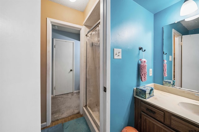 10236 County Road 2253, Tyler, TX 75707 - full bathroom featuring vanity, curtained shower, wood finished floors, and a textured ceiling