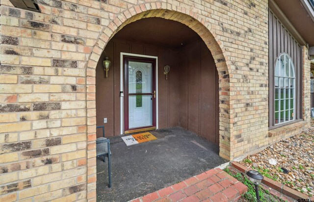 10236 County Road 2253, Tyler, TX 75707 - view of exterior entry featuring brick siding