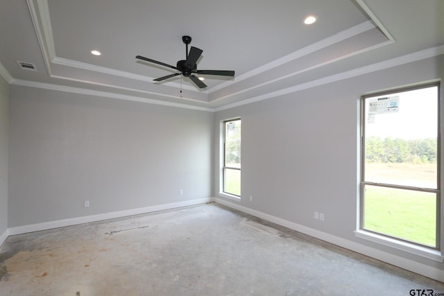 unfurnished room with ceiling fan, a raised ceiling, and crown molding