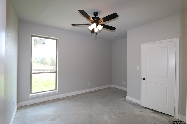 spare room with ceiling fan