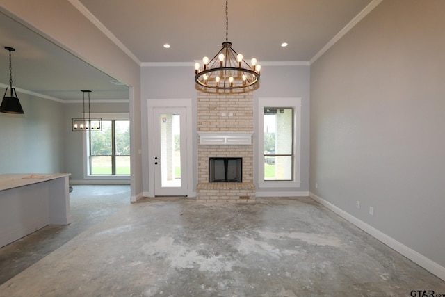 unfurnished living room with a fireplace, an inviting chandelier, and crown molding