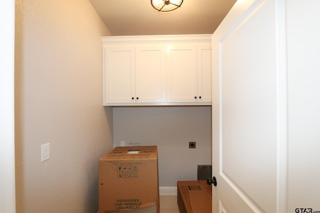 laundry room with cabinets and hookup for an electric dryer