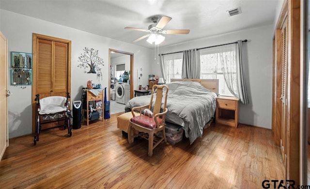 bedroom featuring a closet, a ceiling fan, visible vents, and light wood-style floors