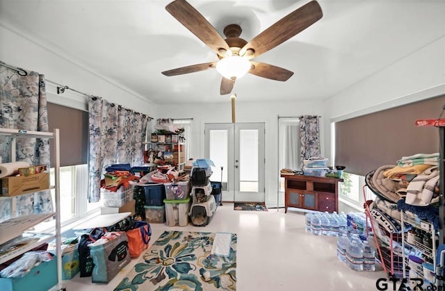 interior space featuring french doors, a ceiling fan, and plenty of natural light