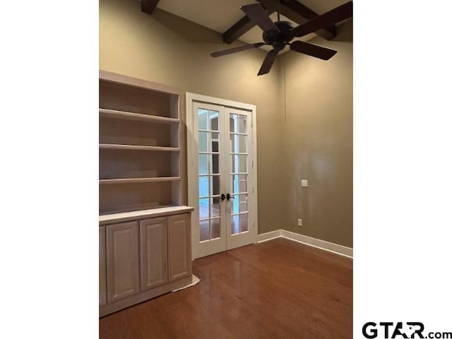 unfurnished dining area with french doors, dark wood finished floors, ceiling fan, and baseboards
