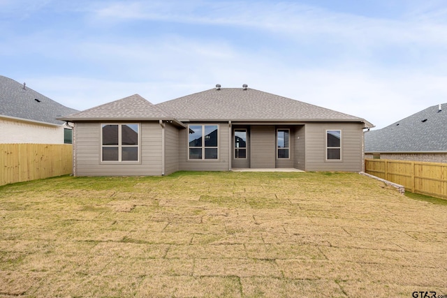 back of property featuring a lawn and a patio area