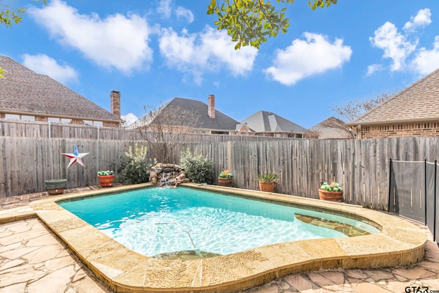 view of pool featuring a fenced in pool and a fenced backyard