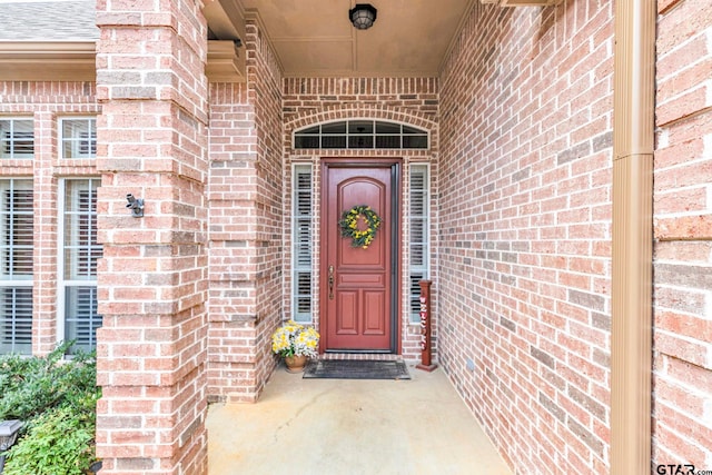 entrance to property with brick siding