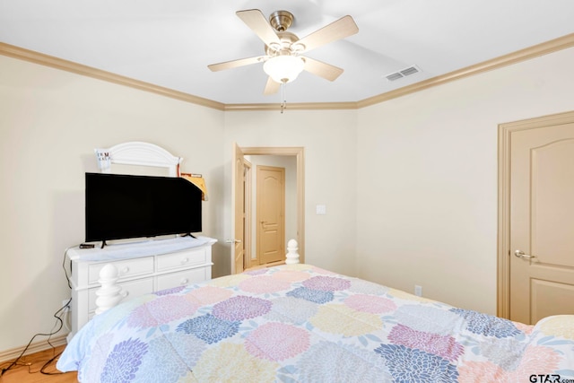 bedroom featuring ceiling fan, baseboards, visible vents, and ornamental molding