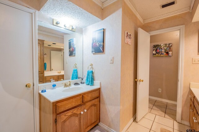 1511 Dolly Ln, Hideaway, TX 75771 - bathroom featuring vanity, ornamental molding, tile patterned flooring, and a textured ceiling