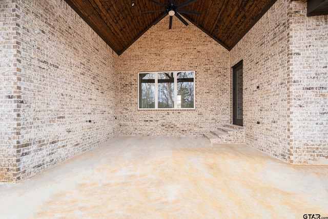 empty room with high vaulted ceiling and wood ceiling