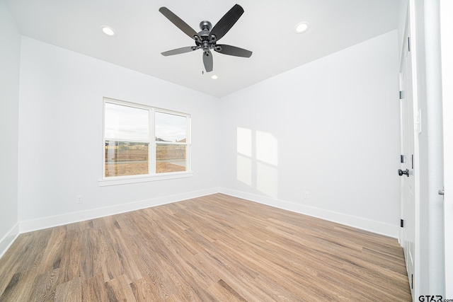 spare room with recessed lighting, ceiling fan, baseboards, and wood finished floors