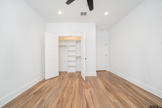 unfurnished bedroom with light wood-style floors, baseboards, visible vents, and recessed lighting