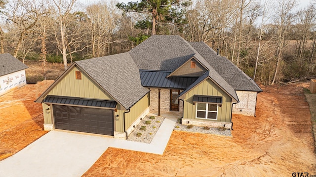 view of front of home featuring a standing seam roof, metal roof, board and batten siding, and roof with shingles