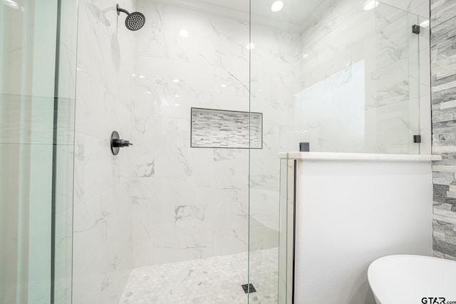 full bathroom featuring a soaking tub and a shower stall