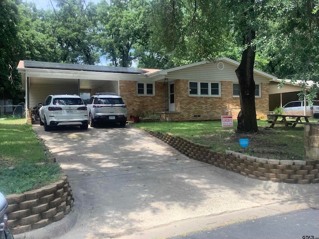 view of front of house featuring a front yard and a carport