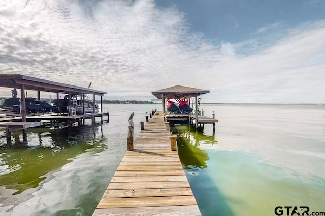 view of dock with a water view and boat lift