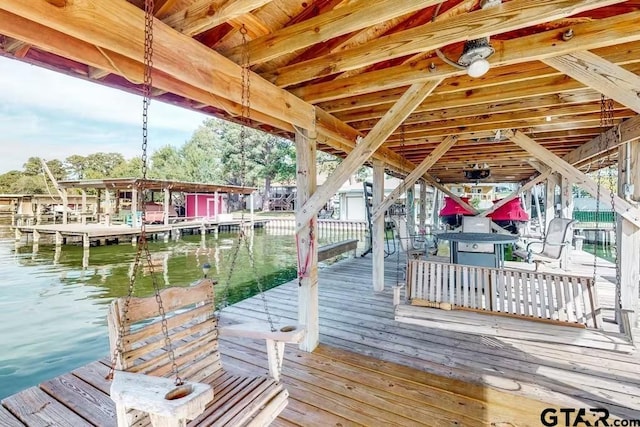 dock area featuring a water view and boat lift