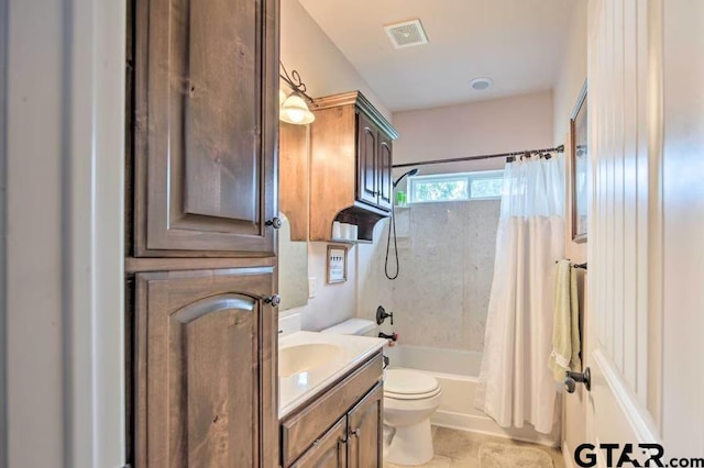 full bathroom featuring shower / bath combo, vanity, and toilet