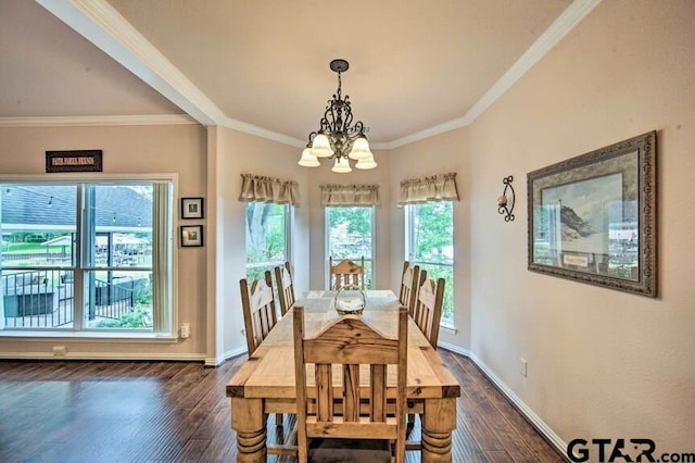 dining space featuring ornamental molding, a notable chandelier, and dark hardwood / wood-style floors