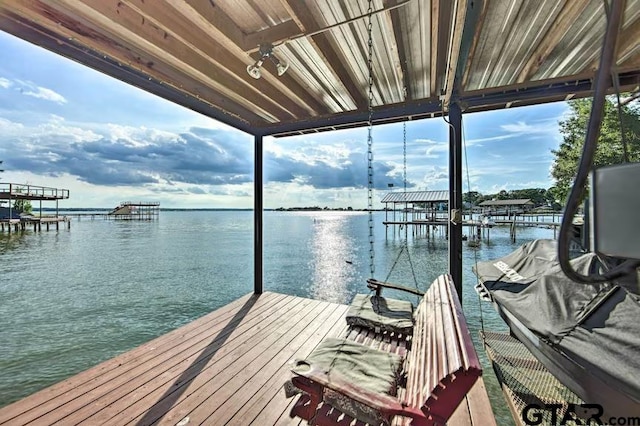 dock area with a water view