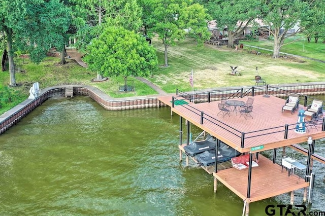 dock area featuring a water view and a yard