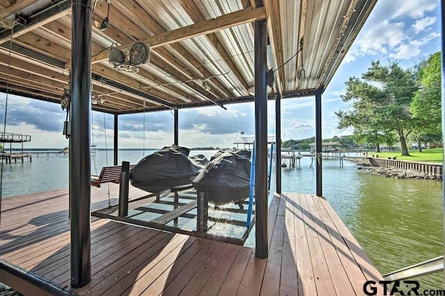 dock area with a water view